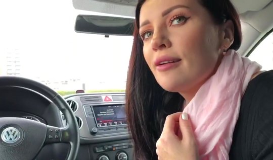 In the car, a girl in clothes opened her mouth for a deep blowjob and a cumshot on the camera